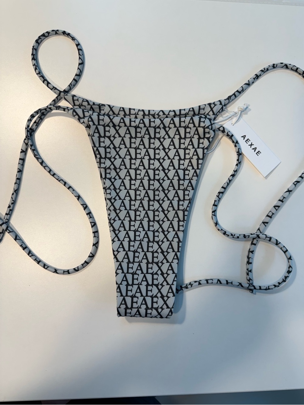 AEXAE Tyra Tie Side Bikini Bottom Small NWT Logo Print Cheeky String Swim Micro